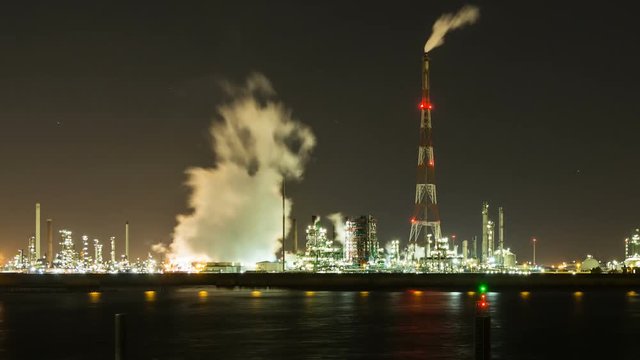 Timelapse sequence of a large oil refinery in the harbor of Antwerp, Belgium in the night.