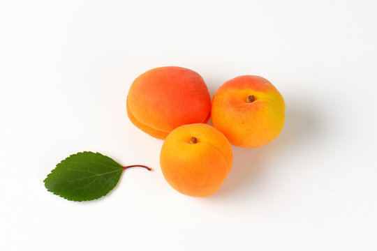 Three fresh apricots