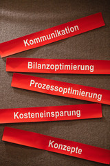 german business keywords pinned on blackboard