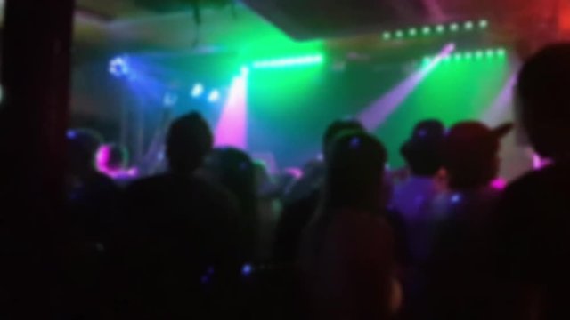 Blurred video of people dancing at a night club in helsinki, finland