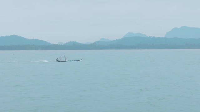 Single fishing boat on the beach. Beautiful shot in Chumphon .Thailand