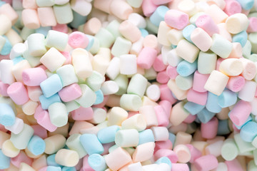 Background or texture of colorful mini marshmallows.