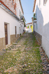 Fototapeta na wymiar Typical cobbled street of a village in Huelva, Linares de la Sie