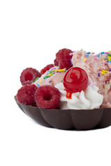 strawberry ice cream with raspberry and sprinkle