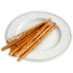 Delicious appetizer crispy sticks of puff pastry with sesame see