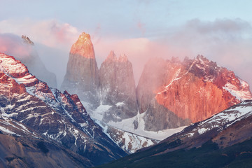 Lighting of the Torres del Paine at sunrise, Chile - obrazy, fototapety, plakaty