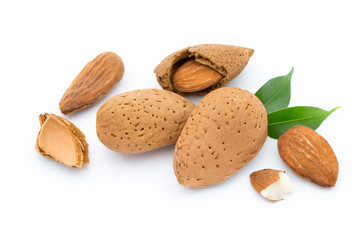 Almonds with leaves isolated on white background