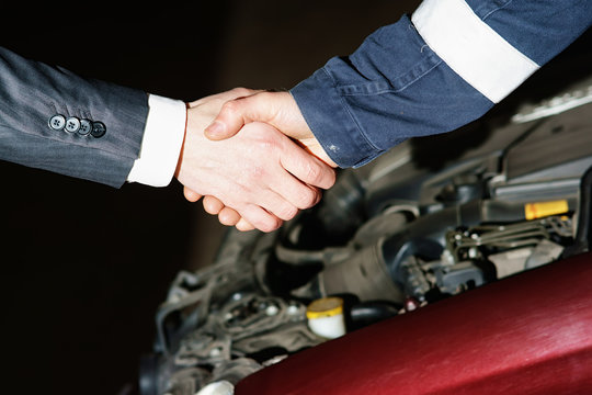 Auto mechanic handshake