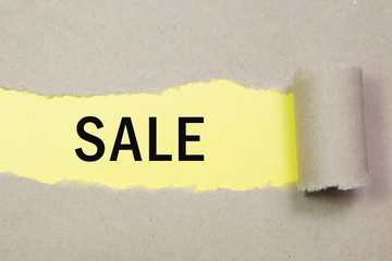 sale written under torn paper