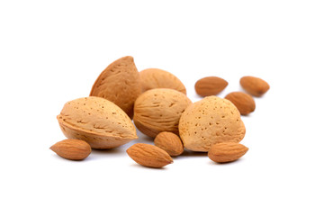 Heap of fresh almonds in shells isolated on white background