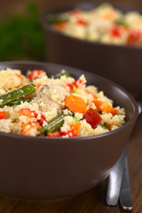 Couscous dish with chicken, green bean, carrot and red bell pepper (Selective Focus, Focus in the middle of the dish)