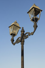 Fototapeta na wymiar Old Fashioned Street Light against a Blue Sky