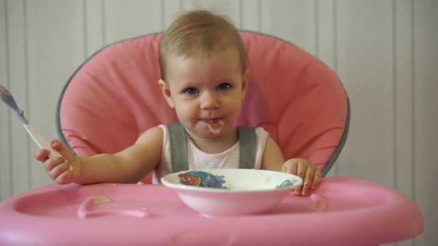 the cute child eats  