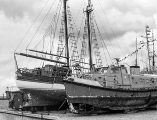 Old collapsing sailboats at the dock, close-up