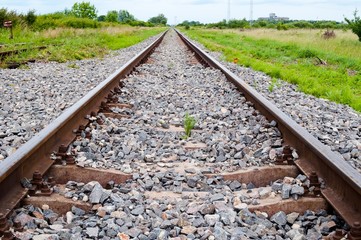 Detail of railway tracks with girder and gravel