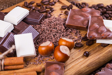 Still life with set of chocolate with coffee grains, closeup