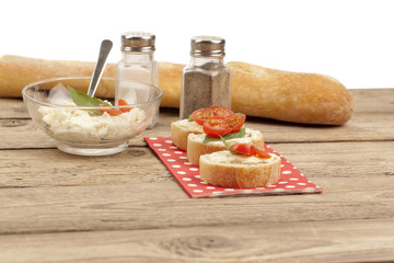 slice buns with butter and tomatoes