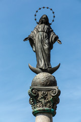 Statue of Virgin Mary in front of the sanctuary in Lesniow near