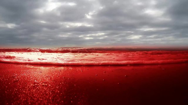 Bloody sea, ocean, water. Sea of Blood and swiftly flying clouds