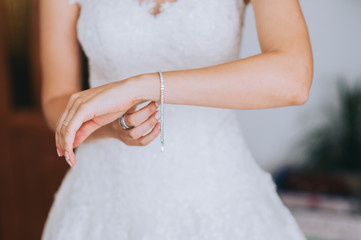 jeweler bracelet on the bride's hand - obrazy, fototapety, plakaty