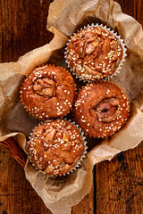 Walnut muffins, delicious dessert on a rustic wooden table