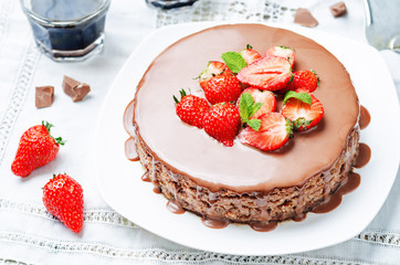 milk chocolate cheesecake with milk chocolate icing and strawber