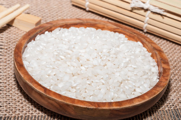 White rice, a tablecloth and one chopsticks