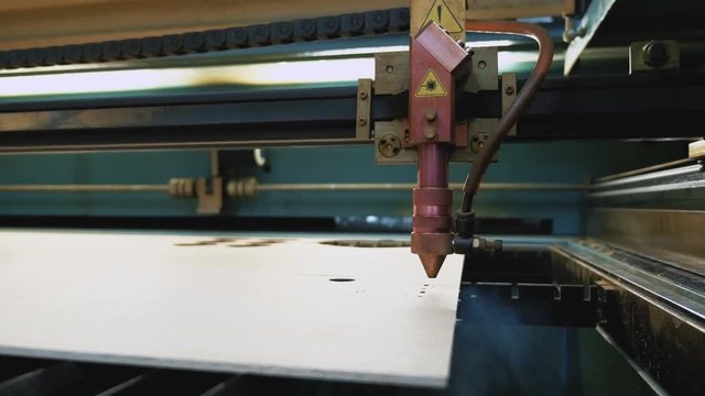 Laser cutting machine at work, dolly shot