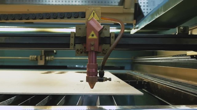 Laser cutting machine at work, dolly shot