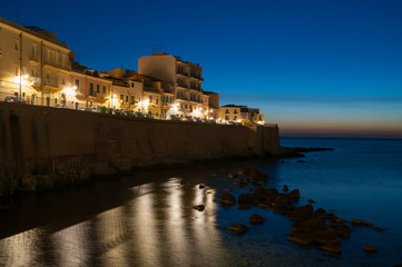 Fototapeta na wymiar Ortigia by night: the eastern side of old Syracuse, Sicily, at dusk