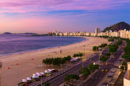 Sunrise view of Copacabana beach and Avenida Atlantica in Rio de Janeiro, Brazil