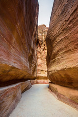 Hiking through the canyon in the ancient city of Petra (Jordan)