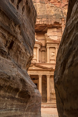 Hiking through the canyon in the ancient city of Petra (Jordan) - opening view of the famous Al-Khazneh (aka Treasury)