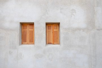 wood window on the cement wall