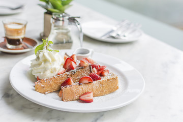 french toasts  strawberries and syrup with vanilla icecream 