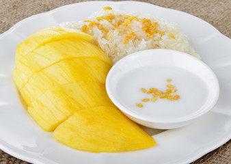 Sweet mango with sticky rice mix with coconut milk