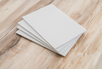 Blank catalog, magazines,book mock up on wood background..