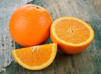 Fresh oranges on wooden background