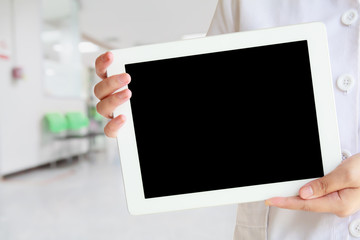 doctor showing tablet computer