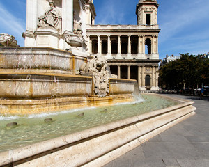 Color DSLR stock image of Church of Saint-Sulpice, Paris, France in the St. Germain district. Fountain in the foreground
