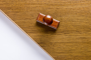 Wooden stamp and a sheet of paper