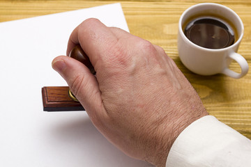 Wooden stamp in hand