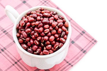 The white cup with Azuki beans or red beans.