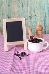 coffee beans and menu board on the wooden table