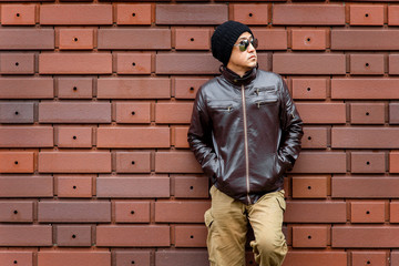 Fototapeta na wymiar An Asian Man in a Brown Jacket 