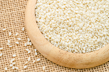 Sesame seeds in wooden bowl.