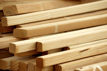 details of piles of wood beams in construction site