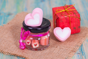 candies sweets heart in bottle on table