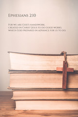 Ephesians 2:10 Vintage tone of wooden cross on book background