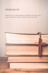 Hebrews 11:1 Vintage tone of wooden cross on book background